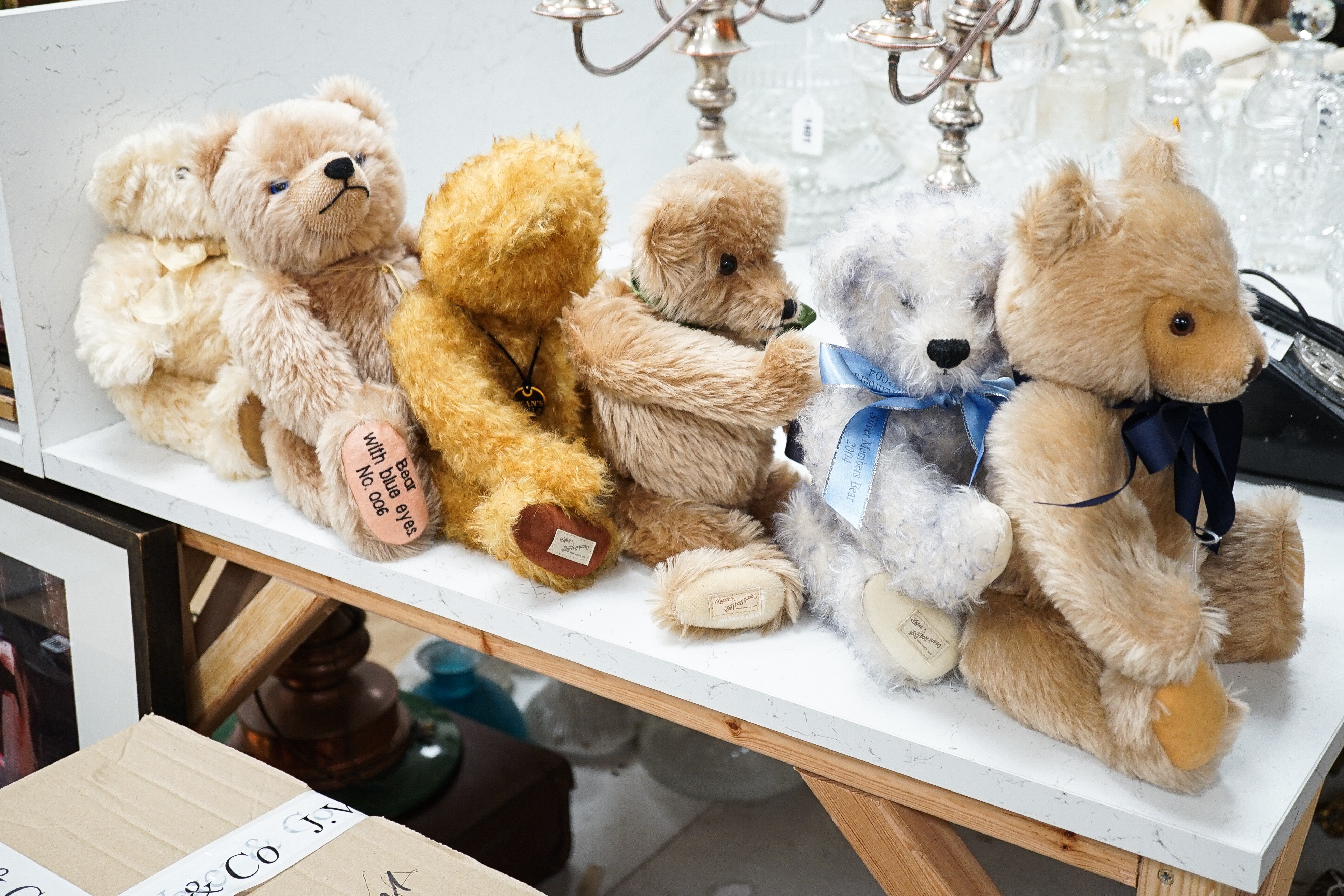 Four Deans teddy bears, a Steiff teddy and a Hermann teddy, Steiff bear, 39 cms high.